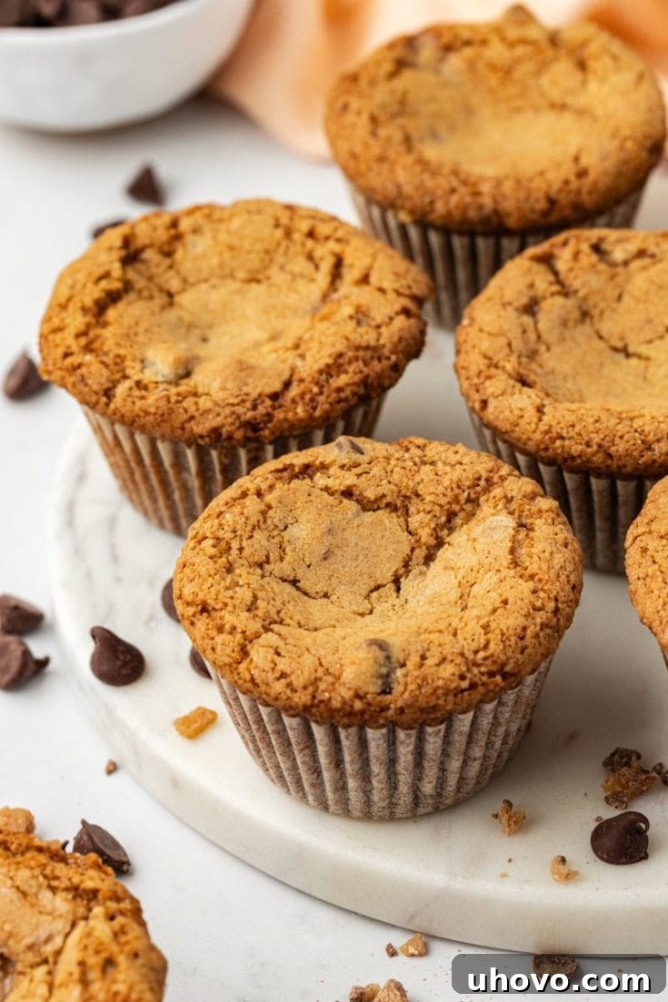 A mouth-watering image of freshly baked blondie cupcakes beautifully arranged on a white marble plate, showcasing their golden tops and tempting texture.