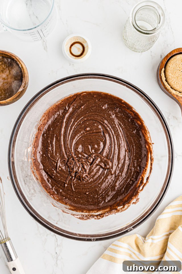 Overhead view of the smooth chocolate cobbler batter ready to be poured into the baking dish.
