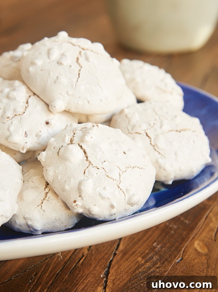 Cinnamon Pecan Puffs on a blue plate, highlighting their soft, chewy, and nutty texture