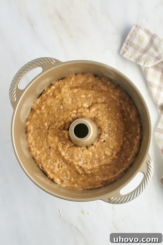 Overhead view of pear bread batter in pan