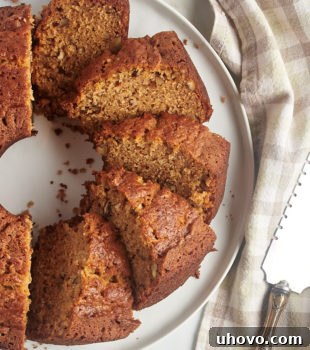 Overhead view of sliced pear bread on round serving tray