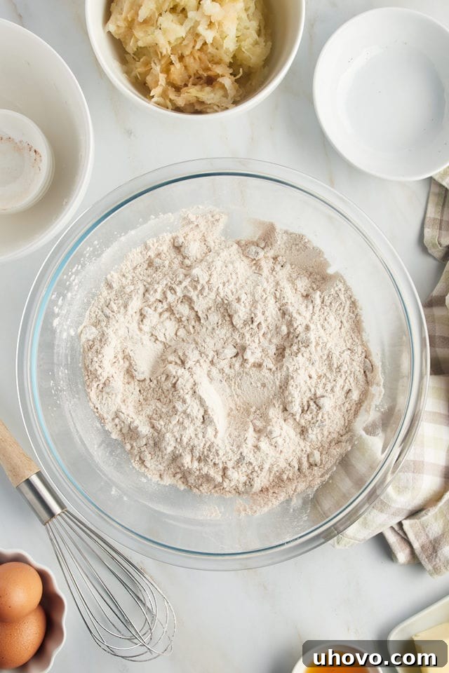 Overhead view of dry ingredients in glass bowl