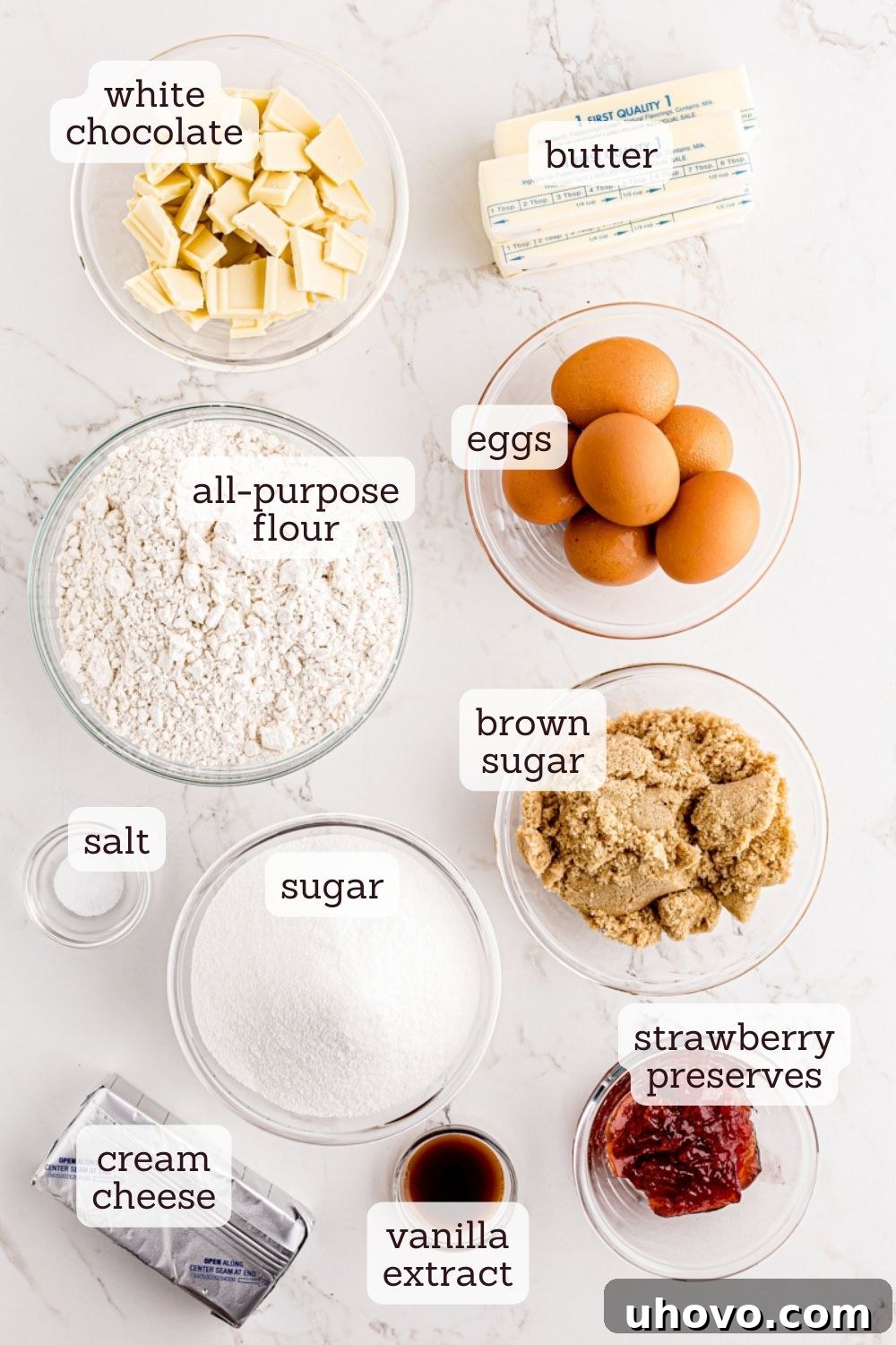 Overhead view of all the essential ingredients laid out for making a delicious cream cheese pound cake, ready for baking.