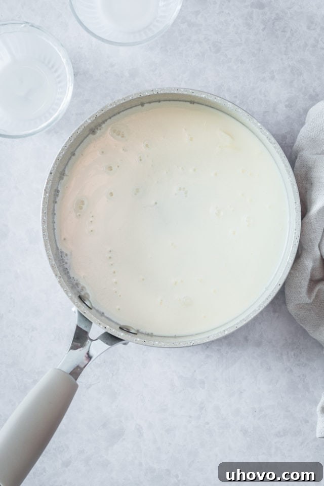 Overhead view of sugar and half-and-half in saucepan