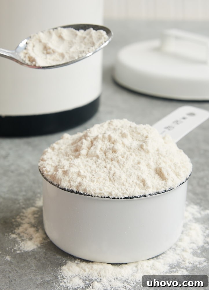 Expert tips for measuring flour accurately to avoid common baking mistakes like dry cakes and tough cookies.
