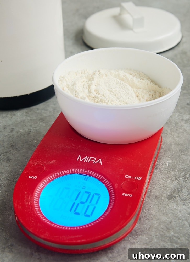 Step-by-step guide on how to measure flour accurately using both a digital kitchen scale and the spoon and sweep method.