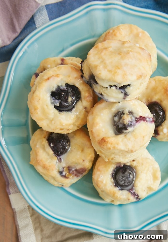 Glazed Blueberry Cream Cheese Biscuits on a blue plate