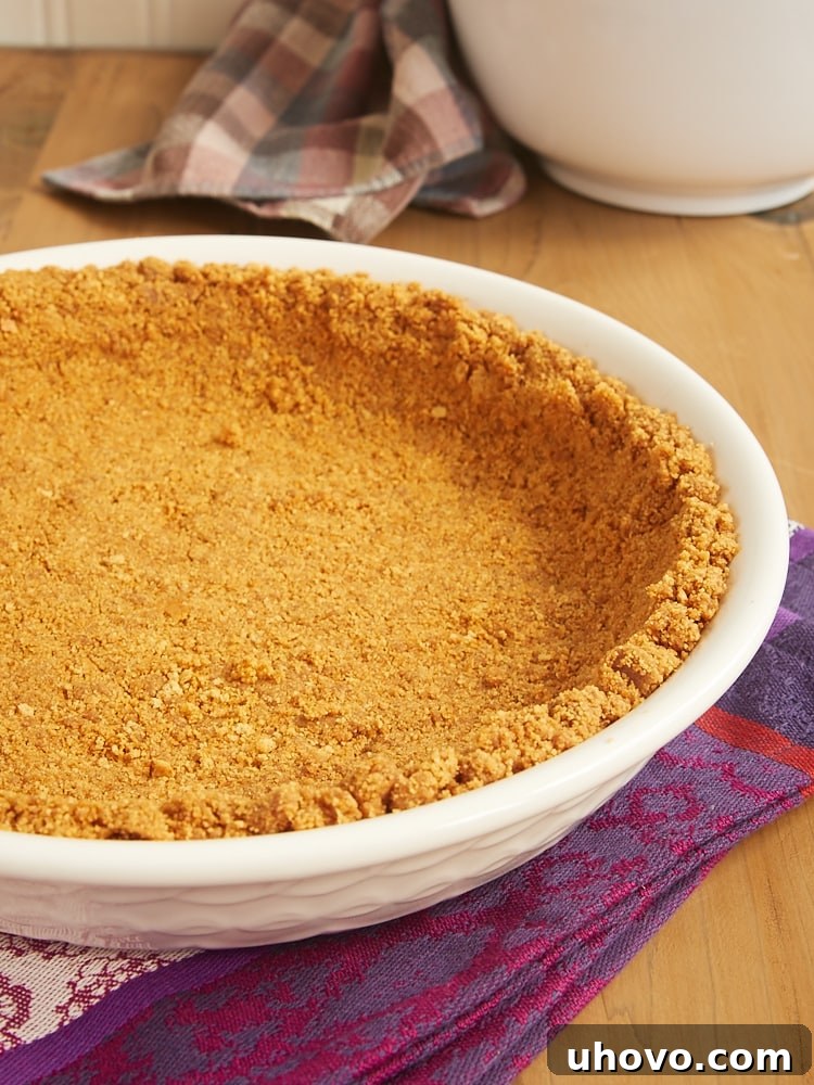 cookie crumb crust in a white pie pan