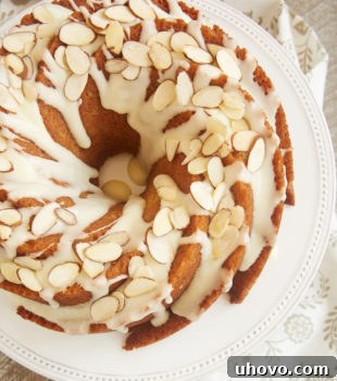Amaretto Almond Bundt Cake topped with an almond glaze and sliced almonds