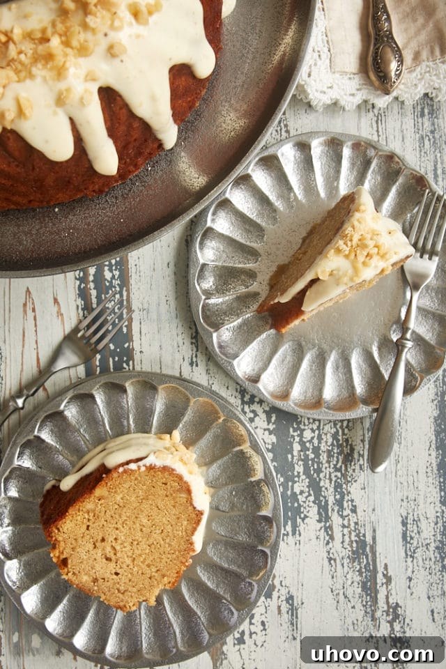 overhead view of slices of Cinnamon Hazelnut Bundt Cake on pewter plates
