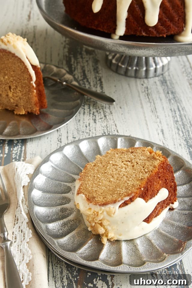 slice of Cinnamon Hazelnut Bundt Cake on a pewter plate