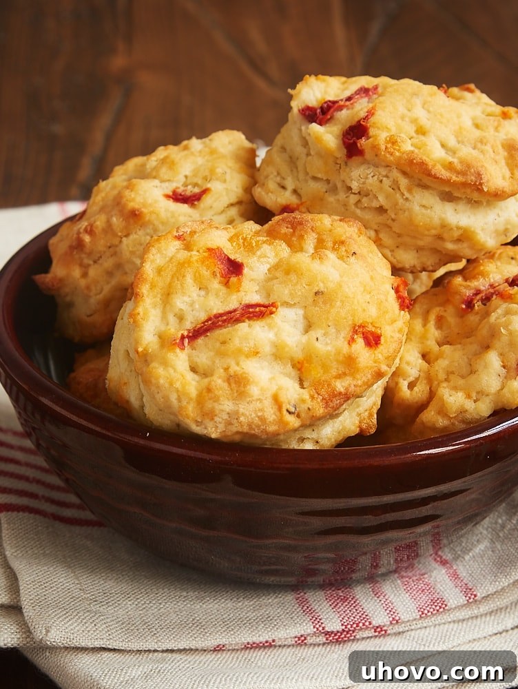 Golden Pimiento Cheese Biscuits in a rustic brown serving bowl, ready to be enjoyed as a Southern comfort food delight.