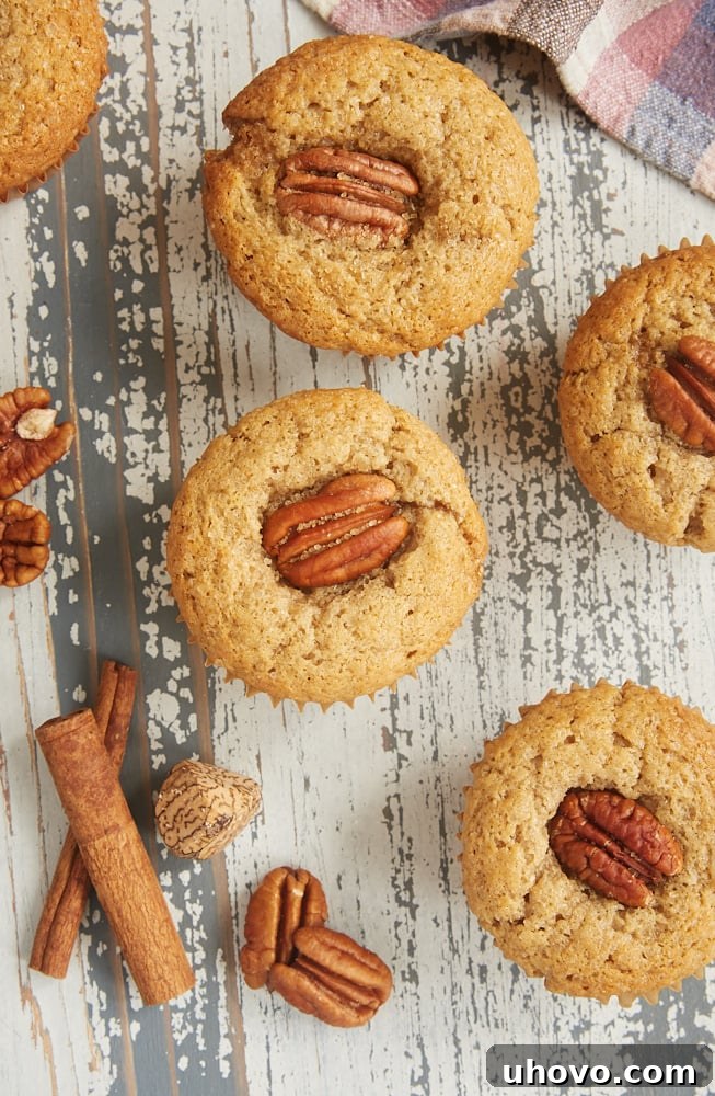 Brown Butter Sour Cream Spice Muffins on a wooden surface