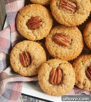 overhead view of Brown Butter Sour Cream Spice Muffins in a towel-line tray