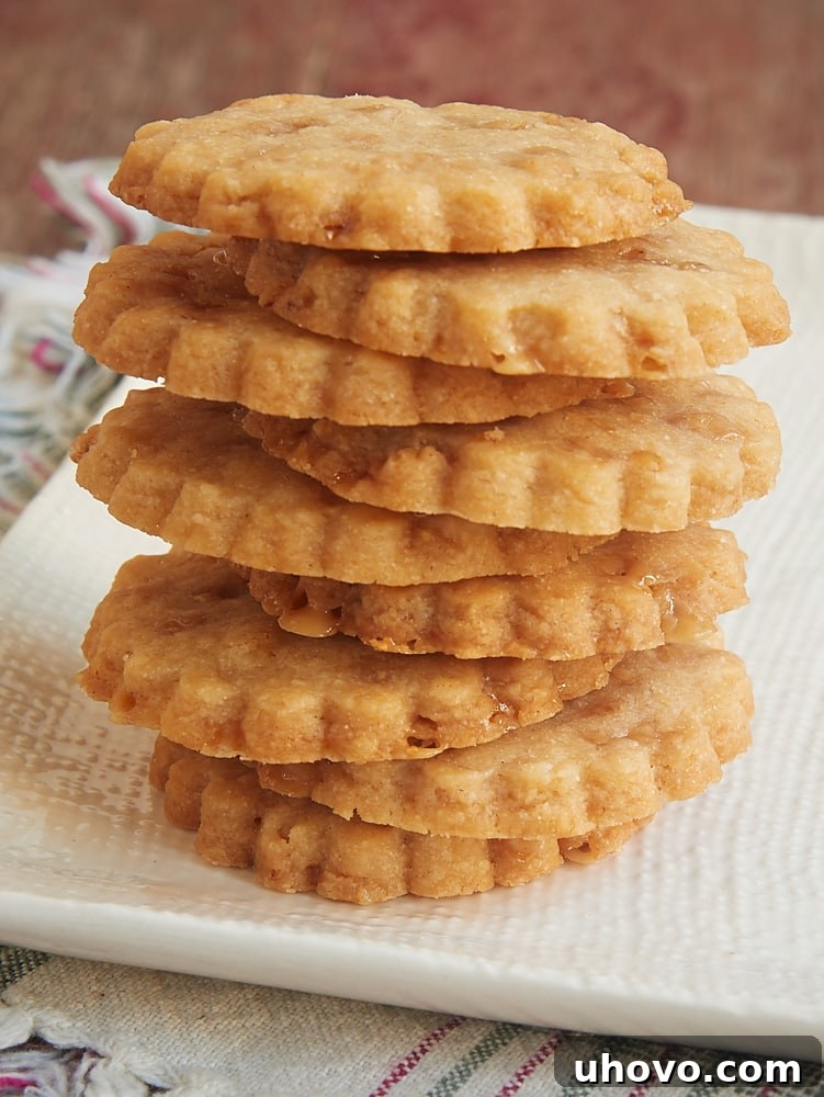 Stack of brown sugar toffee shortbread on a white plate.