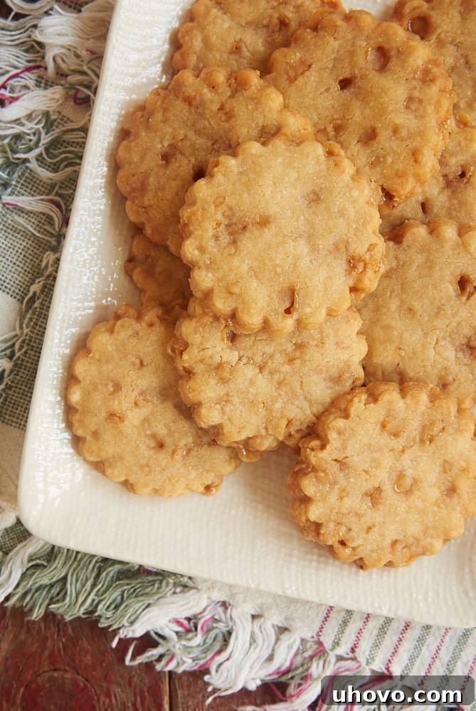 Brown sugar toffee shortbread served on a textured white plate.