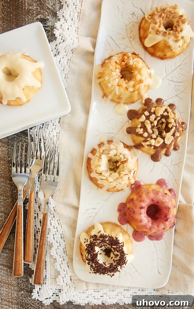 A close-up of freshly baked Mini Cream Cheese Pound Cakes with a delicate glaze.
