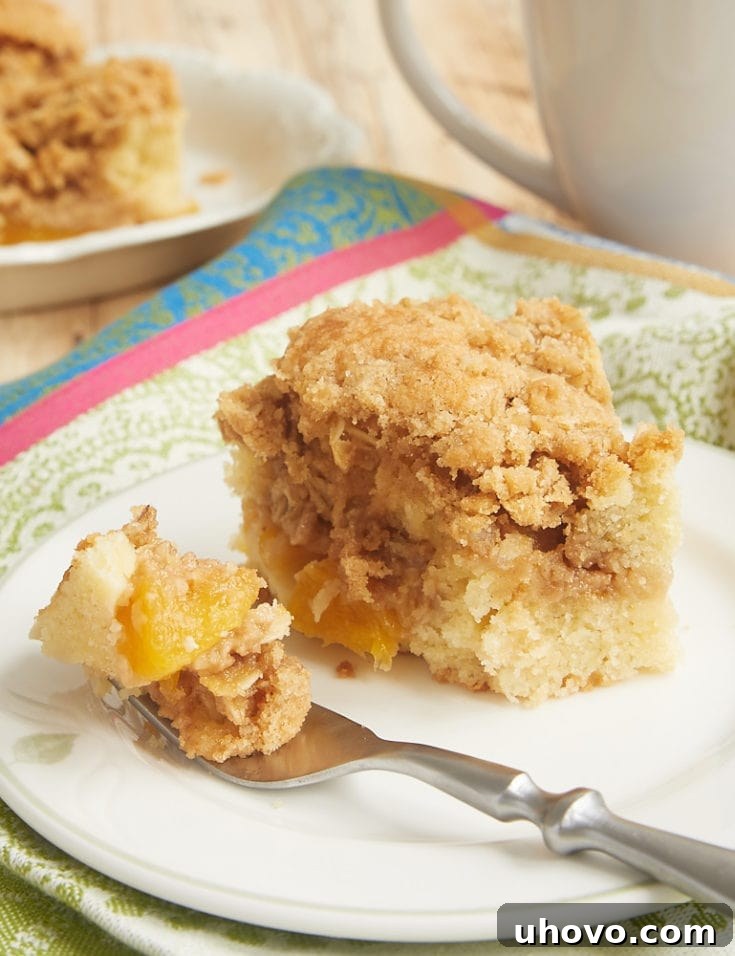 Peach Cobbler Coffee Cake with layers of peaches, cake, and crumb