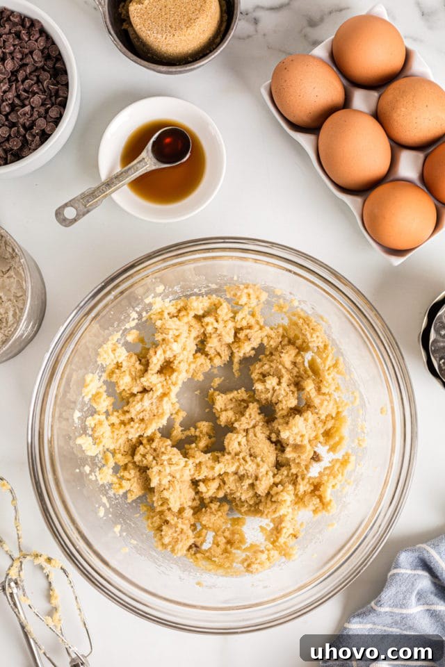 Overhead view of creamed butter and sugar in mixing bowl