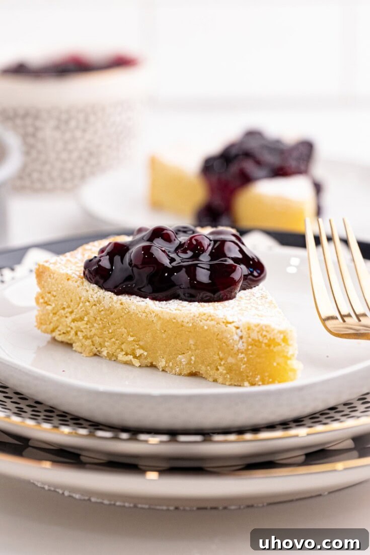 Buttery Almond Gâteau Breton dusted with powdered sugar