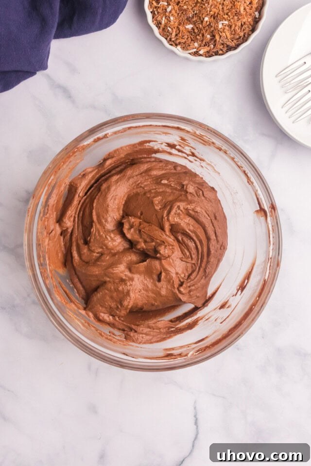 Overhead view of the light and airy chocolate mousse pie filling, perfectly mixed and ready for the crust, in a mixing bowl.