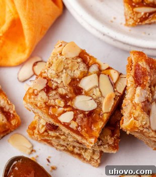 a stack of apricot bars surrounded by more bars