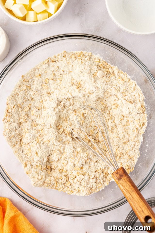 overhead view of mixed dry ingredients for the crust and topping for apricot bars