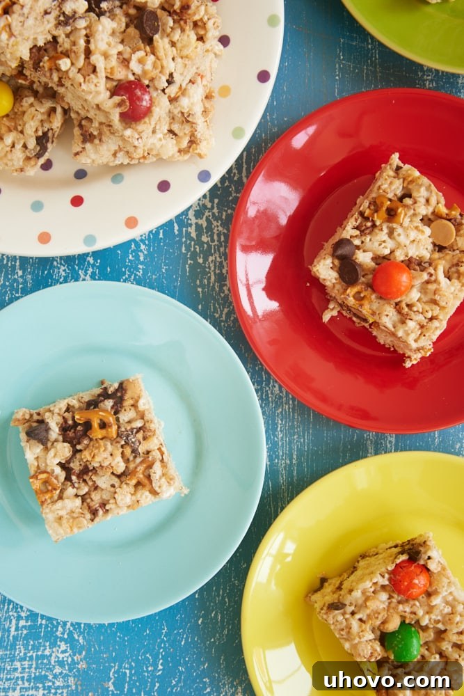 Close-up of Kitchen Sink Rice Crispy Treats arranged artfully on colorful serving plates, ready to be enjoyed