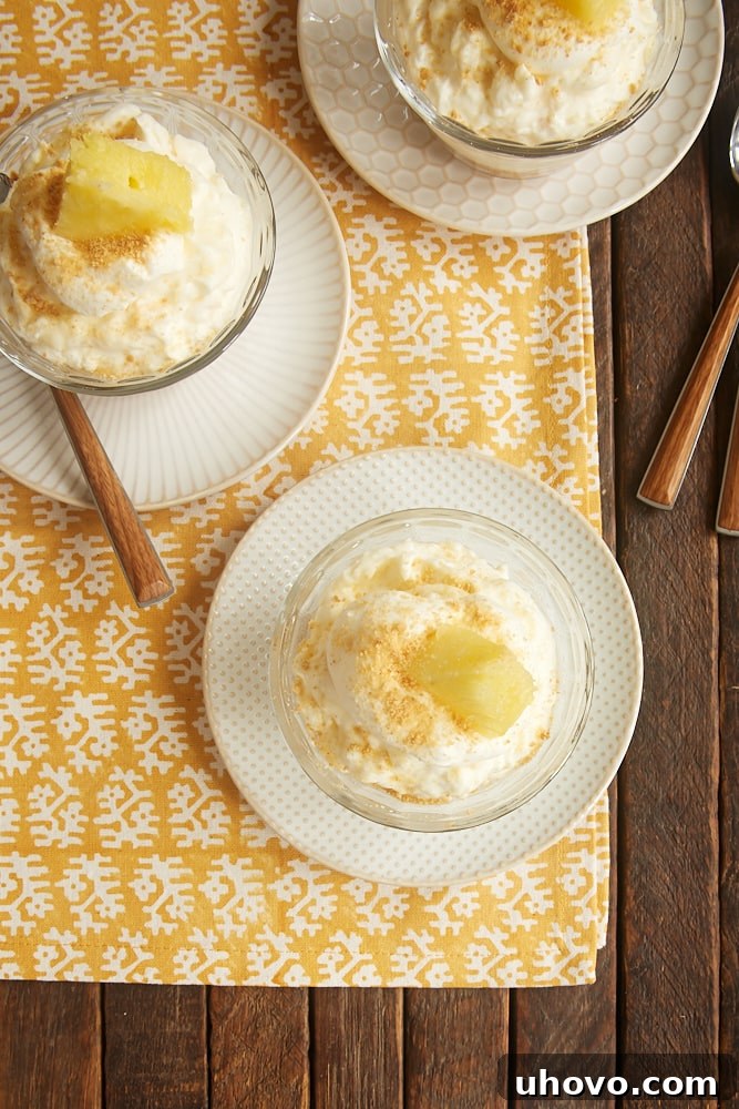 Close-up of a No-Bake Pineapple Cheesecake, showcasing its smooth, creamy texture and light golden crust.