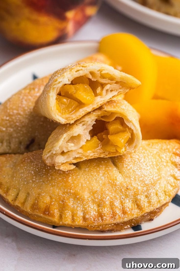 Individual Peach Hand Pies on a cooling rack