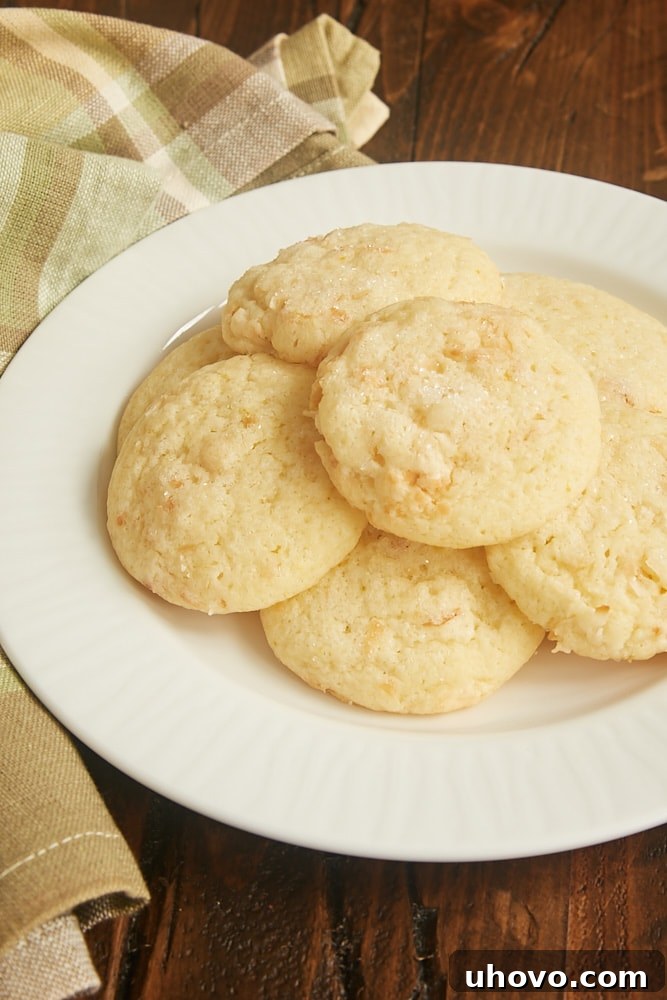 Close-up of lemon and coconut sugar cookies on a cooling rack, showing their texture and coarse sugar topping.
