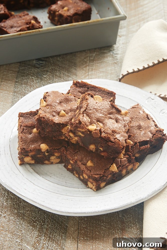 Sliced Peanut Butter Chip Brownies cooling on a wire rack, ready to be enjoyed