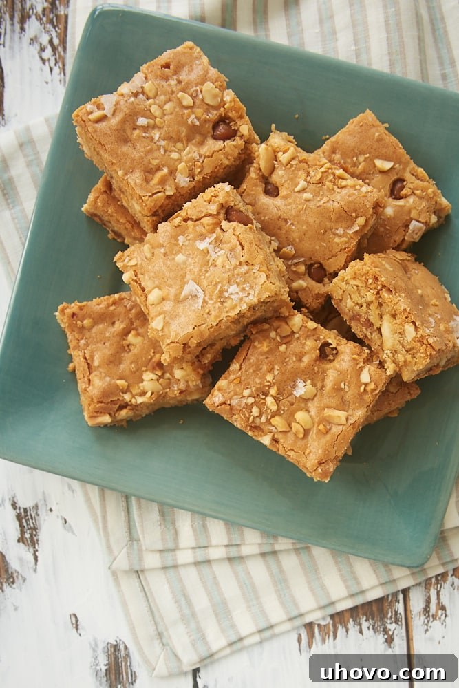 Batch of Caramel Peanut Blondies cooling in a baking pan.