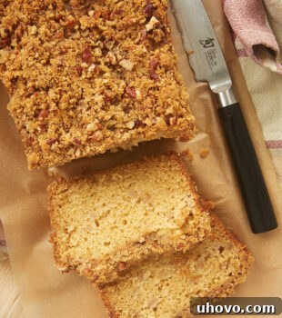 overhead shot of a partially sliced loaf of Ginger Pear Bread