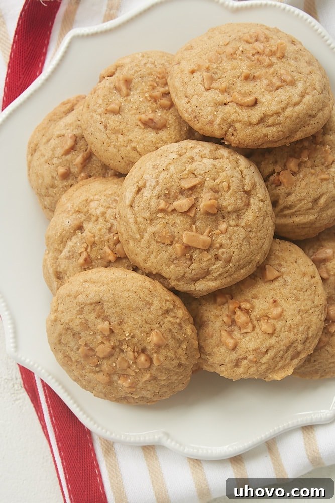 Close-up of baked Spiced Toffee Cookies, showing the texture and visible toffee bits, ready for enjoyment.