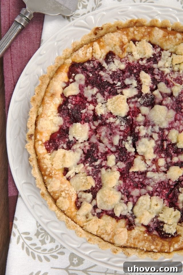 Cranberry Cheesecake Pie on a white cake plate