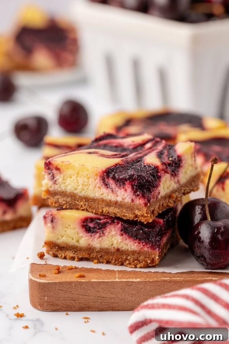 Cherry Cheesecake Bars topped with fresh cherries