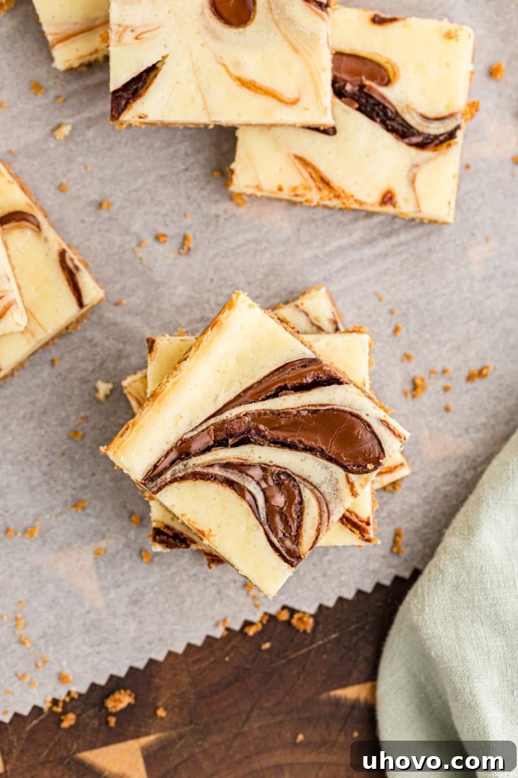Nutella Swirl Cheesecake Bars with a distinct hazelnut swirl