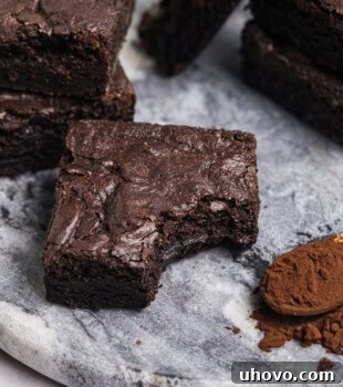 a dark cocoa brownie with a bite missing