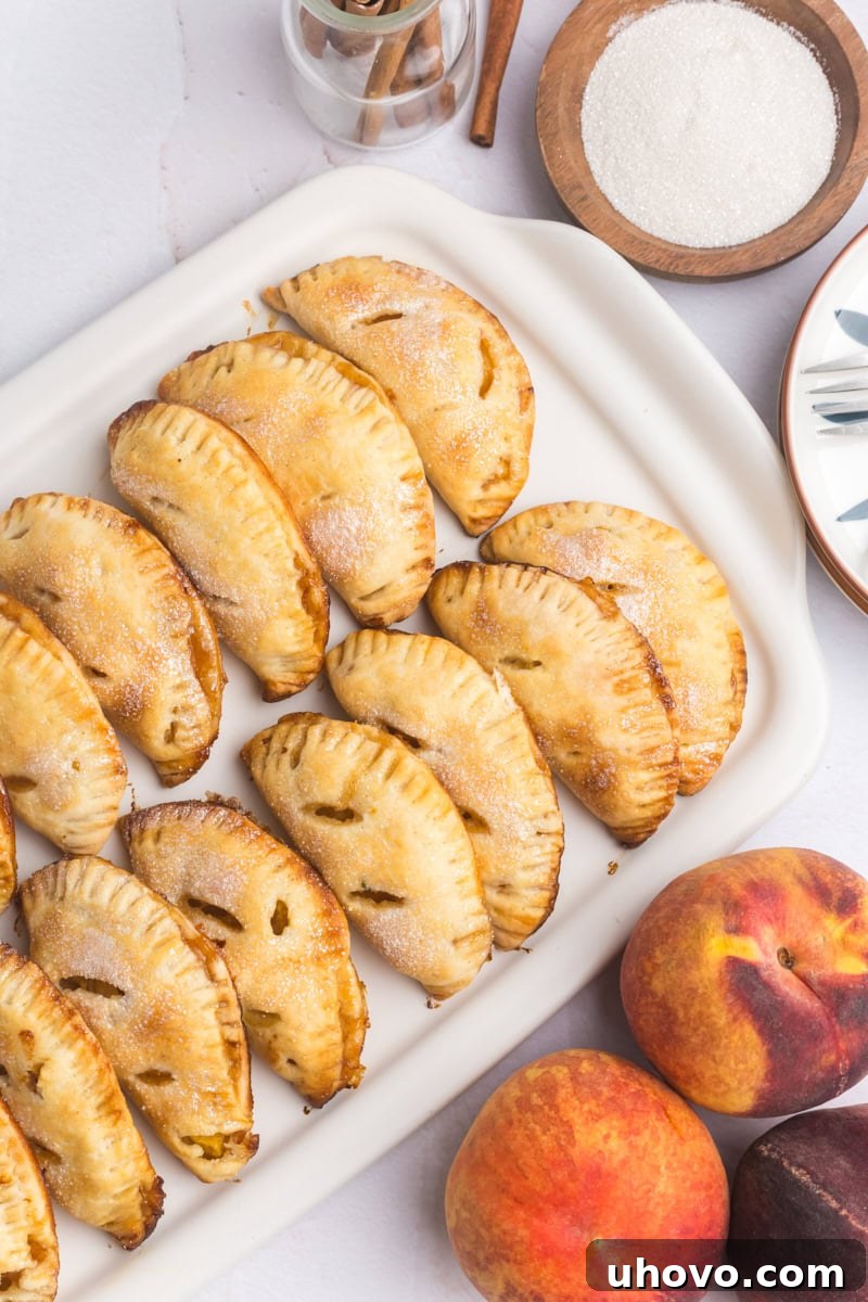 peach hand pies on a white serving tray