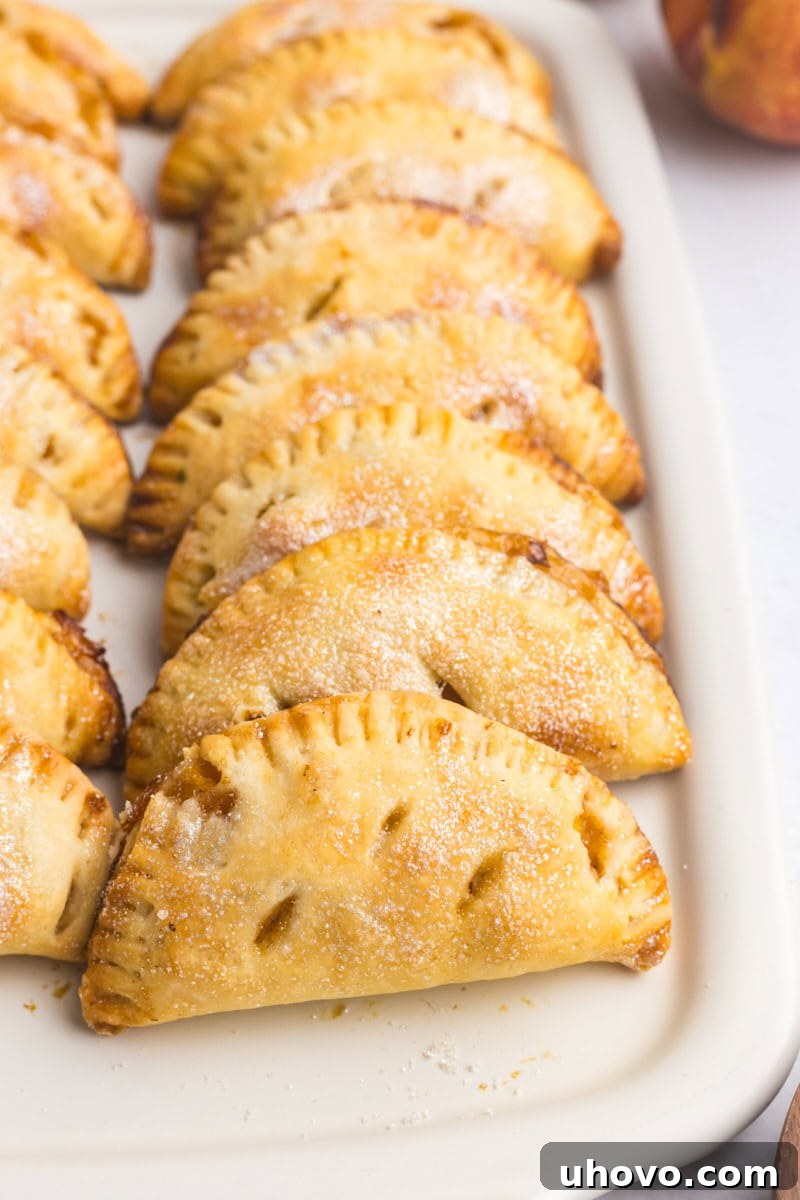 peach hand pies on a white serving tray