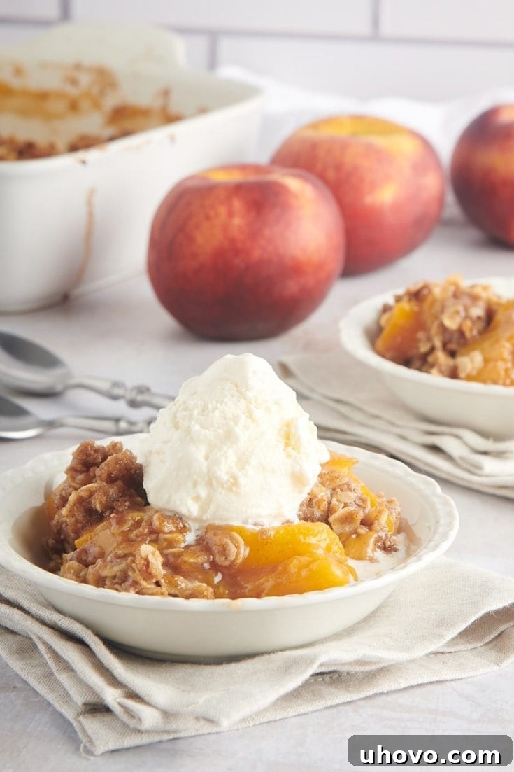 A golden-brown Peach Crisp, fresh from the oven, with a crispy oat topping.