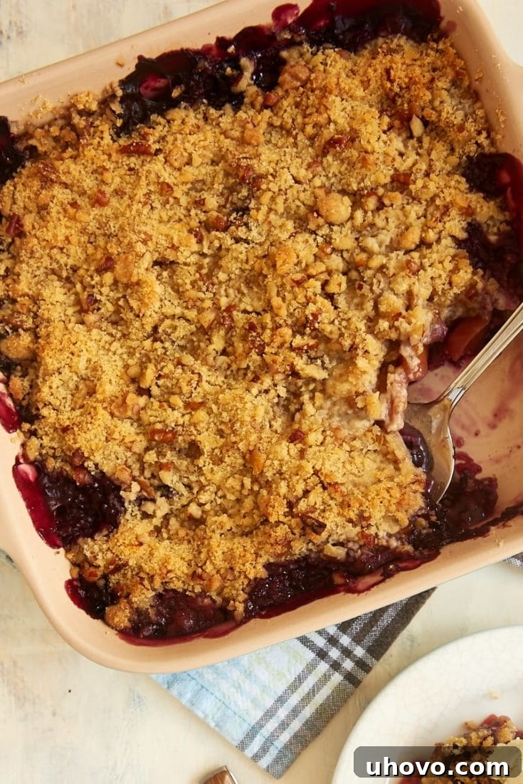 Blueberry Peach Crisp served in a bowl, showing the warm fruit and crispy topping.
