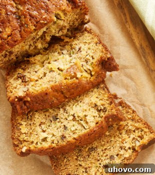 Overhead view of sliced Pineapple Zucchini Bread, ready to eat.