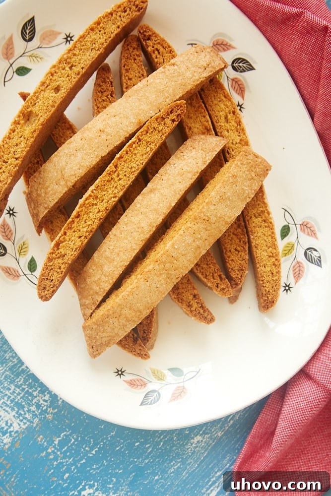 Close-up of a plate filled with golden vanilla biscotti