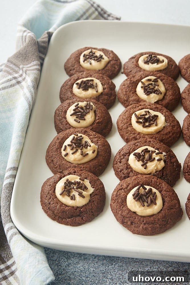 a white tray filled with Chocolate Peanut Butter Thumbprint Cookies