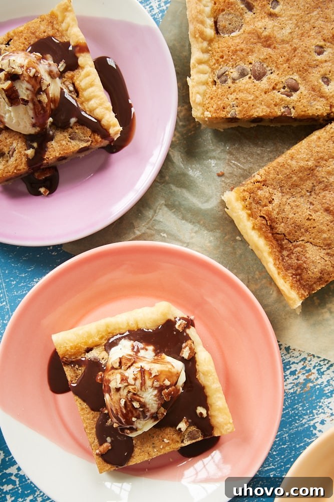 Close-up view of several individual slices of Double Chocolate Chip Slab Pie, each perfectly cut and arranged on vibrant, colorful dessert plates, showcasing the rich, molten chocolate interior.