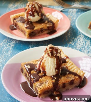slices of Double Chocolate Chip Slab Pie topped with ice cream, chocolate syrup, and nuts