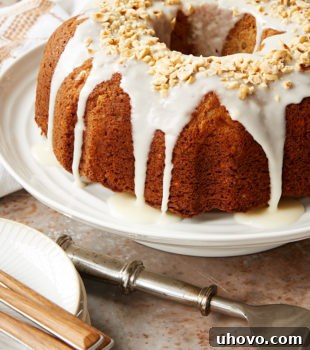 Hazelnut Pear Bundt Cake on a white cake stand