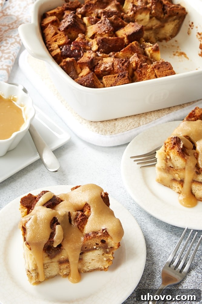 Cookie Butter Pound Cake Bread Pudding in a white ceramic baker with servings on white plates